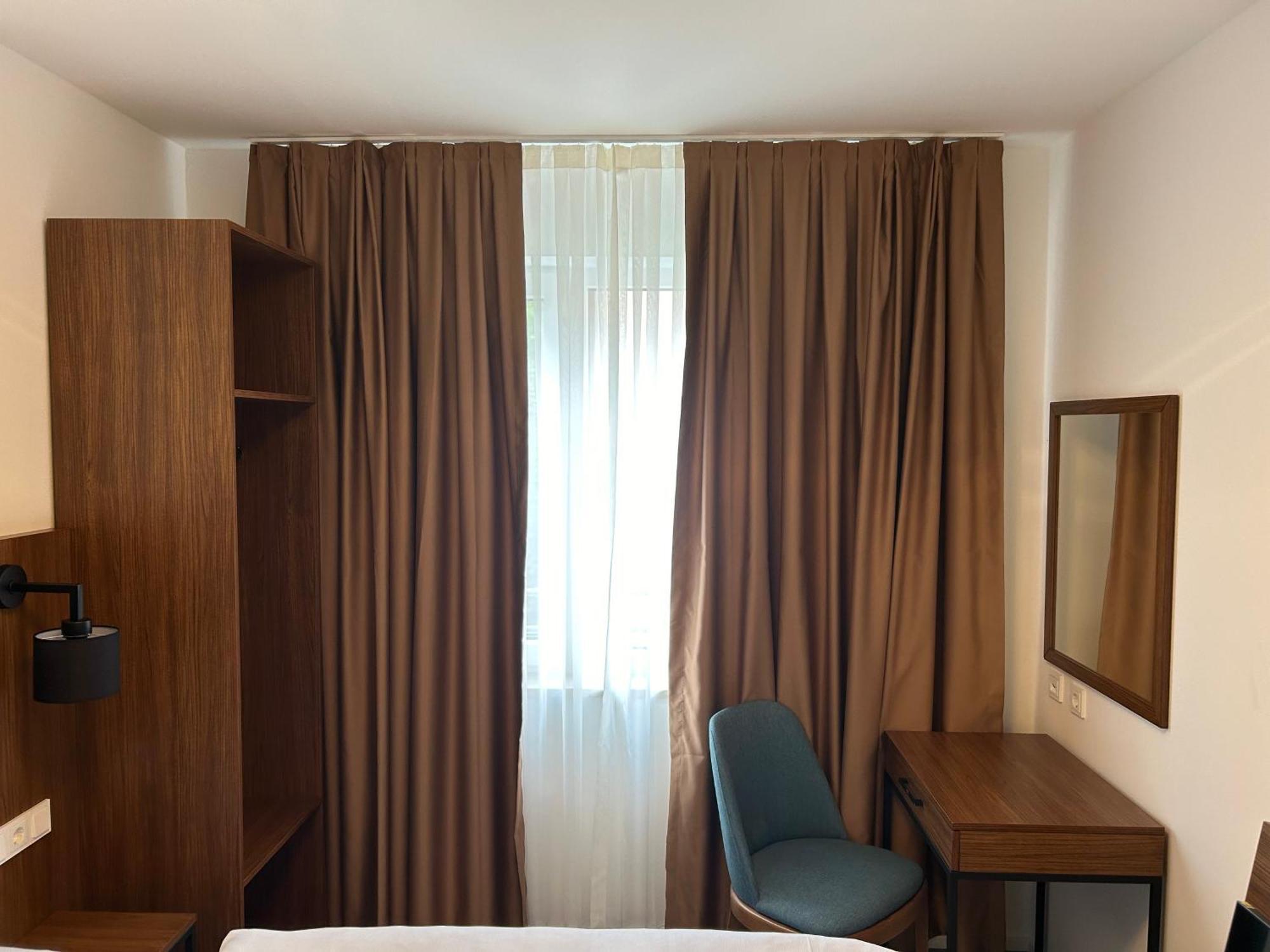 Munique Hotel Muenchen Унтершлайсхайм Экстерьер фото